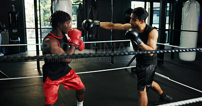 Buy stock photo Combat, sports and training with people in boxing ring for fitness, self defense or sparring. Boxer, challenge and fight with men punching in gym for competition, exercise or performance as athlete
