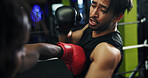 Boxing, men and training with wellness, fight and challenge with power, exercise and fitness. People, gloves and boxer in gym, sparring practice and battle competition with skills, punch and defence