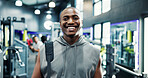 Smile, confident and portrait of black man in gym for workout, fitness or exercise for wellness. Happy, health and face of African male athlete from Nigeria with pride for training in sports center.