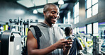 Smile, smartphone and black man in gym, fitness and wellness with digital app for progress. African person, mobile user and athlete in health center, cellphone and social media with exercise or chat