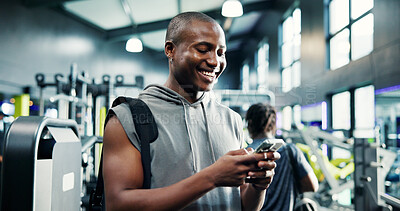 Buy stock photo Smile, smartphone and black man in gym, fitness and wellness with digital app for progress. African person, mobile user and athlete in health center, cellphone and social media with exercise or chat