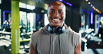 Happy, pride and portrait of black man in gym for workout, fitness or exercise for wellness. Smile, health and face of African male athlete from Nigeria with confidence for training in sports center.