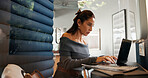 Laptop, typing and woman in office pod for privacy, concentration and journalist research story. Serious employee, computer and writing news review, creative report and hybrid work in business booth