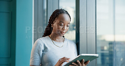 Buy stock photo Business, reading and black woman with tablet in office for real estate copywriting at window. Tech, creative worker or project for content writing, review article or ad campaign for property listing