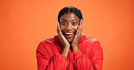 Shock, surprise and portrait of black woman in studio for sale news, announcement and information. Mockup, space and face of person with facial expression, emoji reaction and wow on orange background