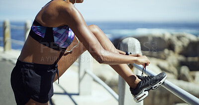 Buy stock photo Hands, exercise and tie shoelaces at beach, promenade or prepare with shoes, start and fitness. Runner, person and sneakers with legs for workout, training or ready by ocean for challenge in summer