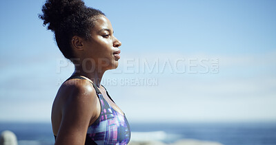 Buy stock photo Black woman, exercise and break at beach, promenade or thinking with space, sky and fitness. African runner, girl and reflection with profile for workout, training or ocean for perspective in Nigeria