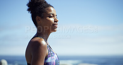 Buy stock photo Black woman, fitness and break at beach, promenade or thinking with space, sky and smile. African runner, girl and reflection with profile for workout, training or ocean for perspective in Nigeria