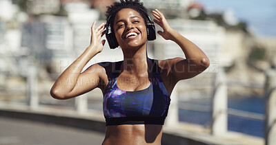Buy stock photo Headphones, fitness and woman with music for workout, running or marathon training outdoor. Promenade, sports and female athlete with audio tech for listening to playlist with cardio exercise.