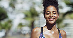 Portrait, athlete and woman on break, smile and training routine for wellness on street and outdoor. Rest, runner and black person with sportswear for exercise, happy or practice for marathon in city