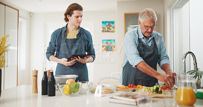 Buy stock photo Men, chef or cooking with tablet for culinary skill, learning or hospitality in home kitchen. Mature, mentor or person with help, technology or ingredients for meal prep, house recipe or food cuisine