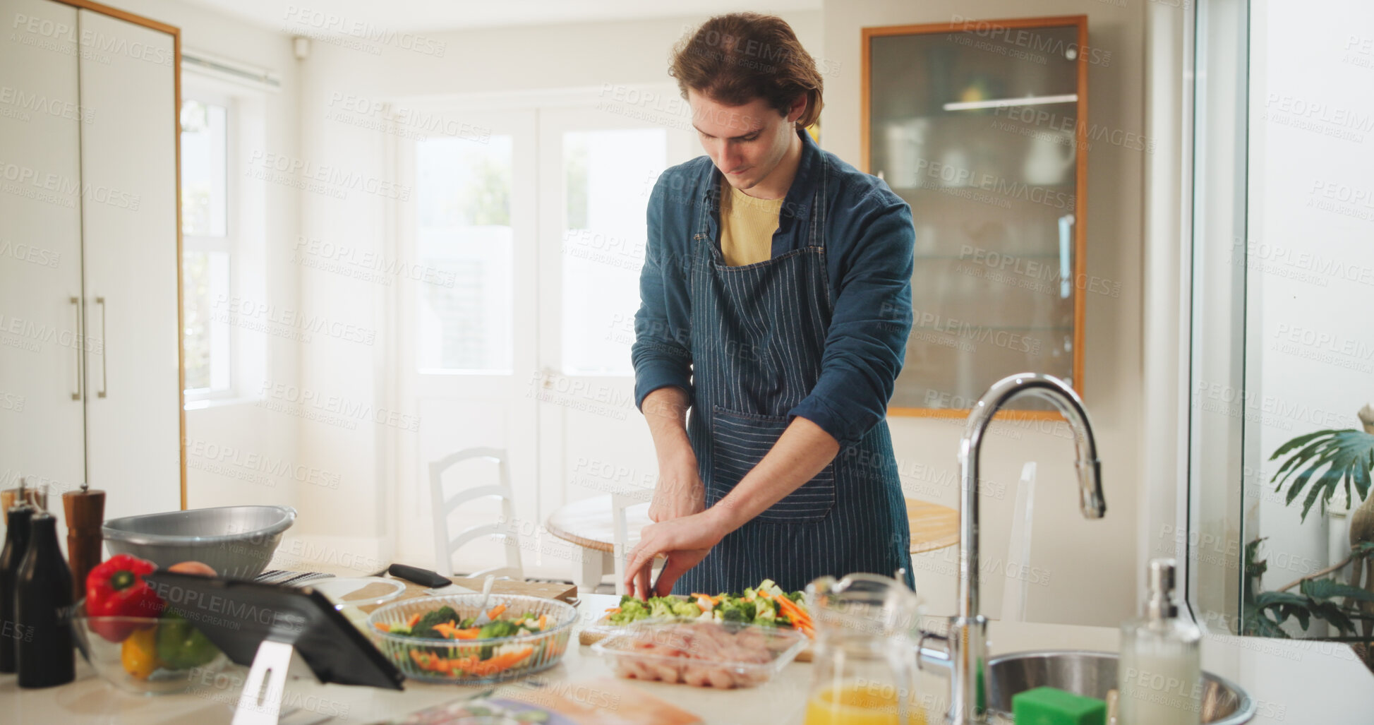 Buy stock photo Man, tablet and meal prep with recipe tutorial, video method or online guide in home. Learning, instructions and person in kitchen with lunch ingredients, diet salad and cooking steps for web blog