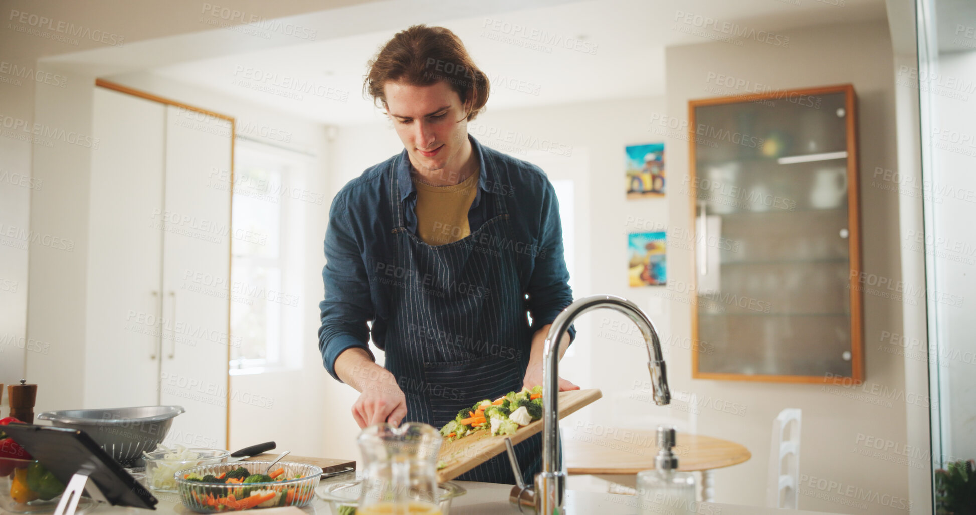 Buy stock photo Man, tablet and cooking with meal prep, recipe tutorial or online guide in home. Learning, video instructions and person in kitchen with lunch ingredients, diet salad and internet steps for web blog