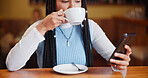 Phone, drinking coffee and woman in cafe for relax, social media or reading morning news. Mobile, beverage and customer in restaurant for internet browsing, online menu or check notification for text