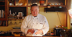 Cooking, restaurant and sushi with Asian man in kitchen for culinary service or hospitality. Cleaning, recipe and seafood with mature chef preparing traditional cuisine as small business owner