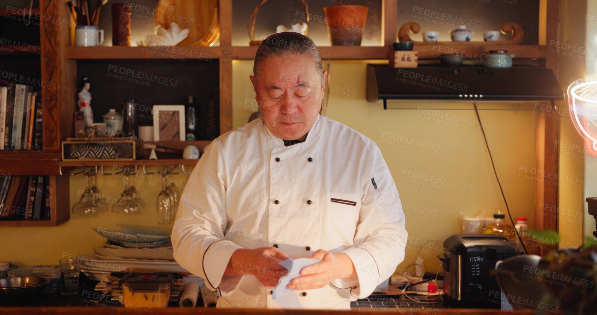 Buy stock photo Cooking, restaurant and sushi with Asian man in kitchen for culinary service or hospitality. Cleaning, recipe and seafood with mature chef preparing traditional cuisine as small business owner