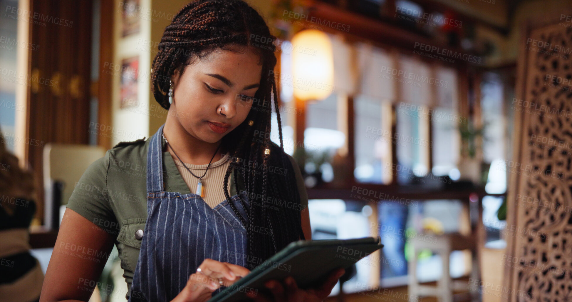 Buy stock photo Woman, waitress and typing with tablet at coffee shop for inventory, checklist or review at restaurant. Person, barista and click with tech, application and report for stock, menu or services at cafe
