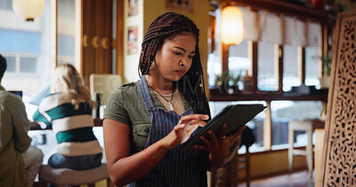 Buy stock photo Woman, waitress and click with tablet at coffee shop for inventory, checklist or review at restaurant. Person, barista and typing with tech, application and report for stock, menu or services at cafe