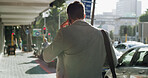 Back, business and man with phone call in city for discussion, travel schedule and deal feedback. Male person, mobile and listen to conversation for morning commute, consulting client and negotiation