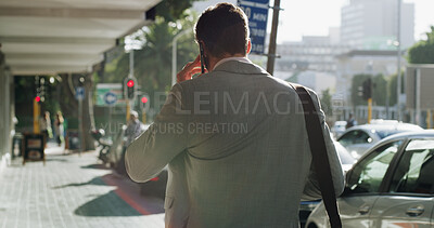 Buy stock photo Back, business and man with phone call in city for discussion, travel schedule and deal feedback. Male person, mobile and listen to conversation for morning commute, consulting client and negotiation