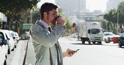Buy stock photo Businessman, phone and drinking coffee in street, travel and booking taxi on web for commute to workplace. Person, smartphone and profile in city with app for ride, transport and drink in Portugal