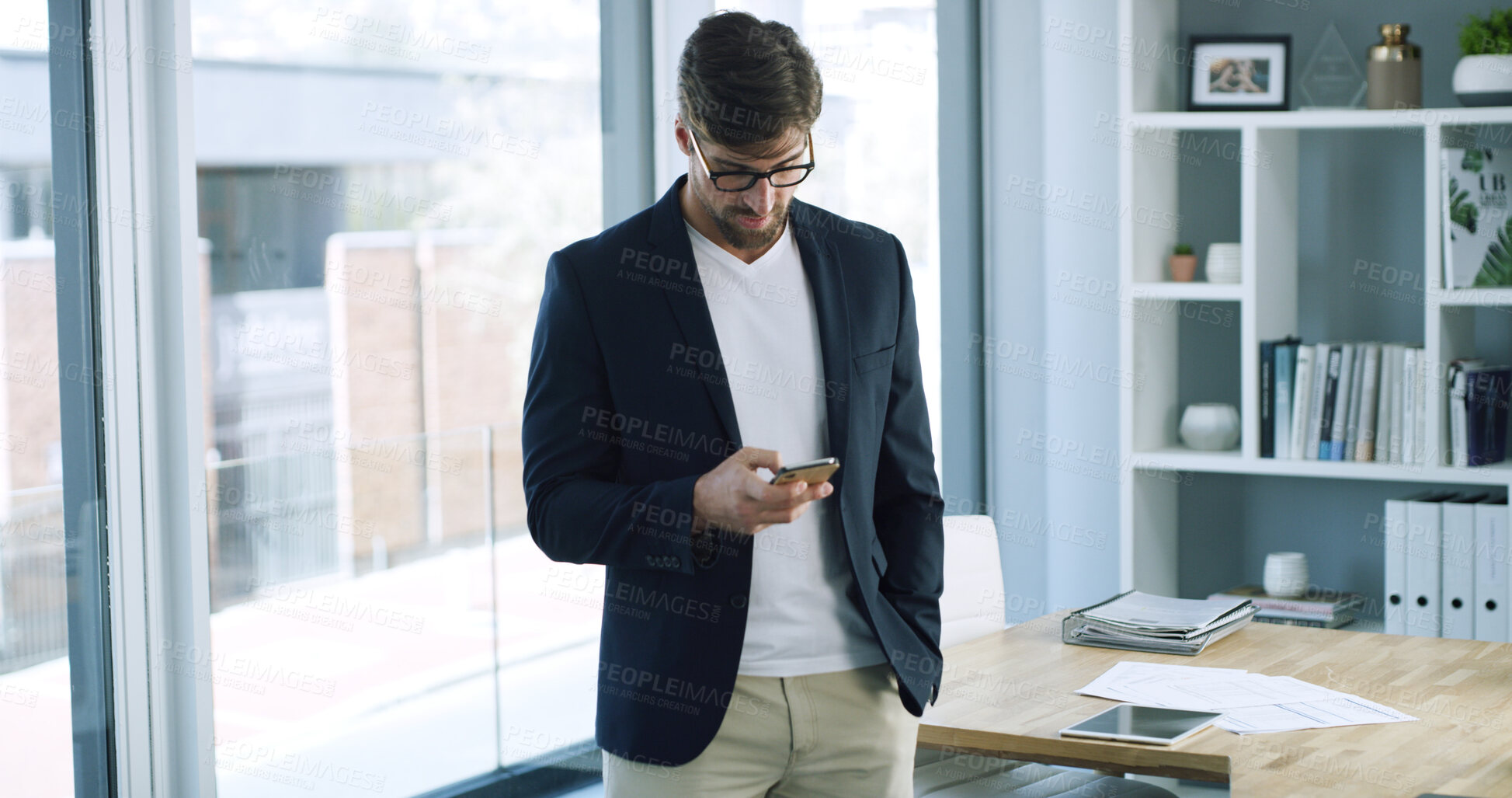 Buy stock photo Texting, employee and man with phone, office and communication with contact on social media and web. Reading, message and person with mobile for networking, serious and browsing on app or online