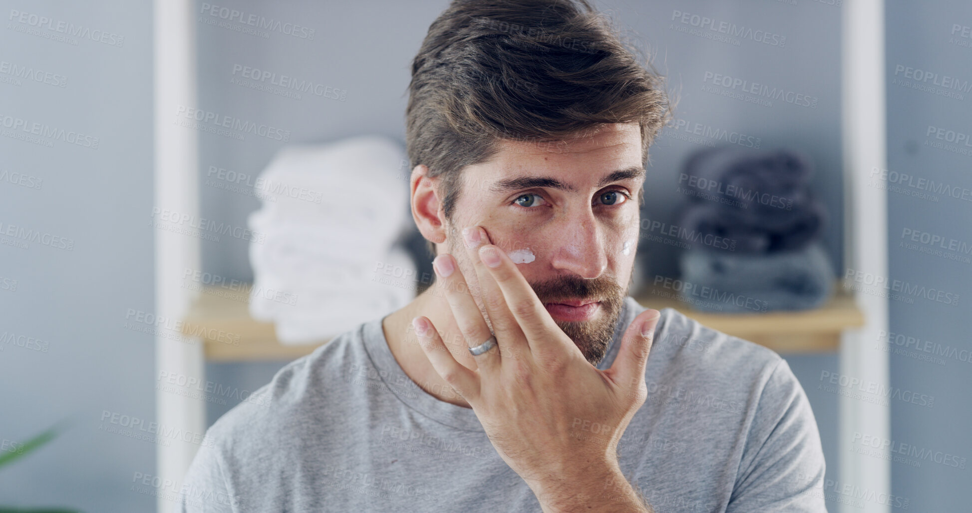 Buy stock photo Portrait, cream and beauty with man in bathroom for skincare, morning routine and cosmetics. Self care, dermatology and grooming with person and lotion in home for moisturizer, hygiene and aesthetic