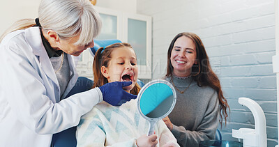 Buy stock photo Child, dentist and oral hygiene or teeth health with advice from orthodontist with mirror by mouth. Girl, family or woman practitioner in clinic for dental care, wellness and search for cavity