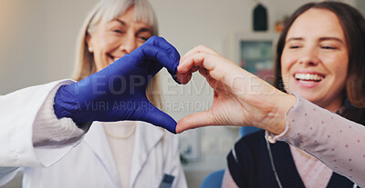 Buy stock photo Dentist, heart hands and smile with people in office for consulting, support and oral hygiene. Teeth cleaning, healthcare and trust with women in dental clinic for orthodontist treatment and advice