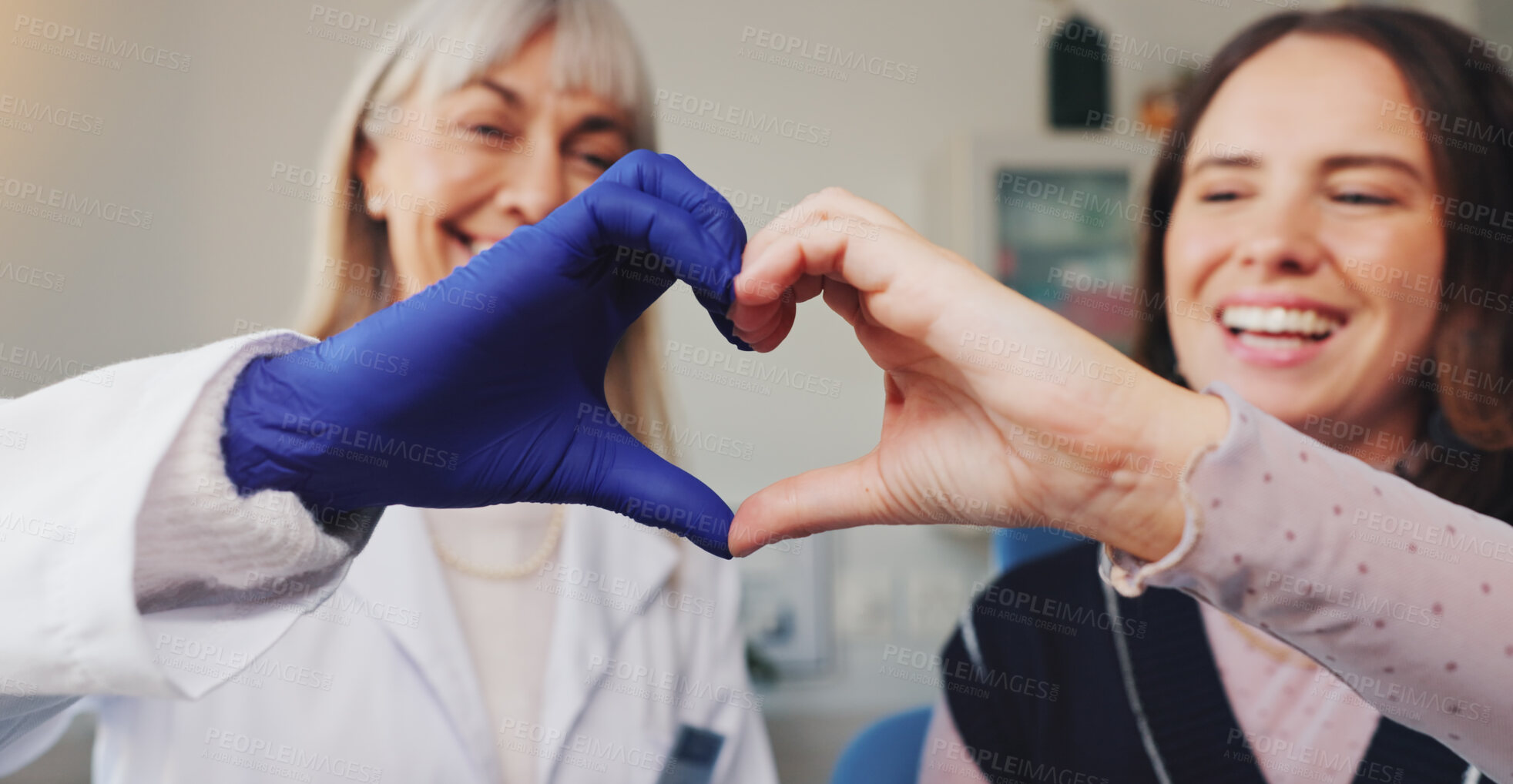 Buy stock photo Dentist, heart hands and smile with people in office for consulting, support and oral hygiene. Teeth cleaning, healthcare and trust with women in dental clinic for orthodontist treatment and advice