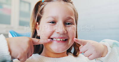 Buy stock photo Happy girl, portrait or pointing with teeth for dental hygiene, checkup or appointment at clinic. Child, kid or big smile with mouth for medical orthodontist, tooth surgery or oral and gum healthcare