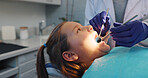Hands, dental hygiene or girl in chair, tools or cavity with wellness, consultation or tooth decay. Child, medical service or young patient with equipment, oral care or light with treatment or health