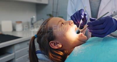 Buy stock photo Hands, dental hygiene or girl in chair, tools or cavity with wellness, consultation or tooth decay. Child, medical service or young patient with equipment, oral care or light with treatment or health