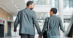 Business, luggage and couple holding hands at airport for global travel, work holiday or support. Back, black people and walking together for international conference, corporate opportunity and trip