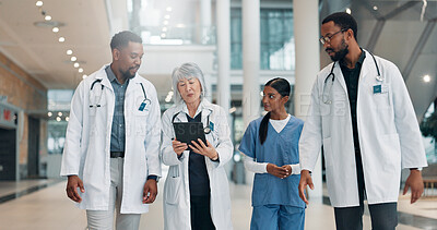 Buy stock photo Doctor, woman and tablet with team in lobby with discussion, review and medical research at clinic. People, mature leader and group with tech, feedback and report with healthcare services at hospital