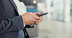 Business person, hands and browsing with phone at airport for travel, online booking or app. Employee, traveler or user with mobile smartphone or email for research, communication or job opportunity