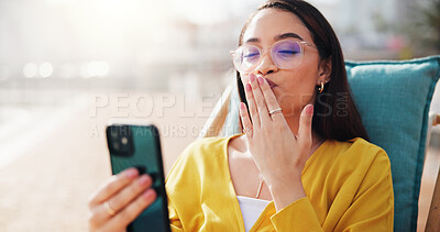 Buy stock photo Woman, video call and kiss with influencer for vacation, holiday or outdoor getaway experience in city. Female person, vlogger and social media with smile for travel, stream review or relax at resort