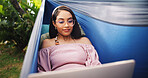 Woman, laptop and relax in hammock outdoor for research, reading email and proofreading article. Journalist, remote work and pc for story planning, post schedule and information with news publication