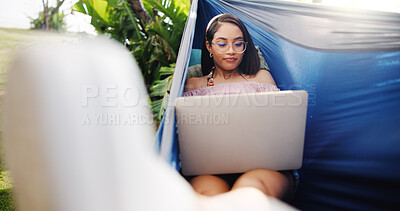 Buy stock photo Woman, laptop and rest in hammock outdoor for research, reading email and proofreading article. Journalist, remote work and pc for story planning, post schedule and information with news publication