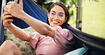 Outdoor, tourist and woman on hammock, selfie and photography for summer vacation, happy and travel. Relax, traveller and person with smile for profile picture, post and memory for holiday or trip