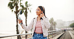 Selfie stick, live streaming and woman with thumbs up outdoor for travel, vlog and tourism review. Like hand gesture, smile and influencer in city for social media photo on holiday with internet fans