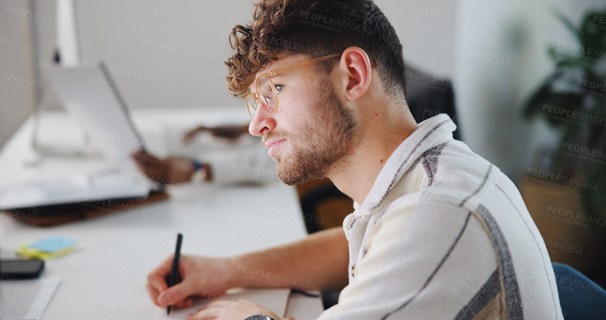 Buy stock photo Creative, design and writing with business man in coworking office for planning or problem solving. Notes, solution and thinking with designer person in workplace for learning or research on computer
