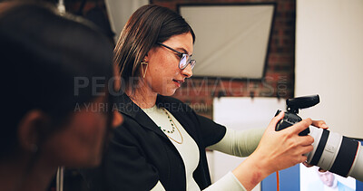 Buy stock photo Woman, photographer and check camera for photoshoot results, catalog and selection backstage. Person, technology and lens focus for filming production, editing picture and photography quality control