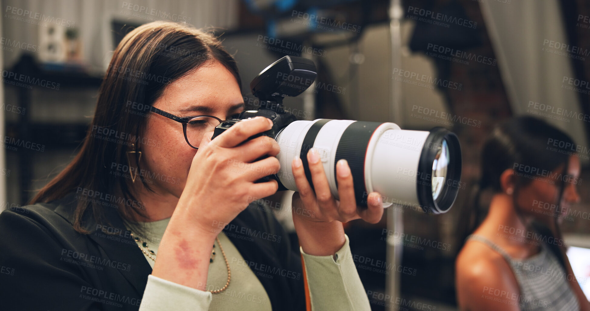 Buy stock photo Camera, photographer and woman in production studio for fashion photoshoot, media and art. Creative, photography and person behind the scenes with lens for filming, picture and videography on set