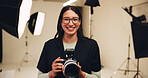 Camera, photographer and portrait of happy woman in studio for photoshoot or media production. Smile, photography and creative person behind the scenes with lens for filming, picture or videography