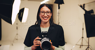 Buy stock photo Camera, photographer and portrait of happy woman in studio for photoshoot or media production. Smile, photography and creative person behind the scenes with lens for filming, picture or videography