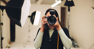 Buy stock photo Camera, photographer and woman in studio for picture, photoshoot or media production. Technology, photography and creative person behind the scenes with lens for filming, capture image or videography