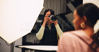 Buy stock photo Woman, photographer and camera on set for photoshoot, production and magazine casting. Female person, equipment and backstage with model for filming content, capture image and photography industry