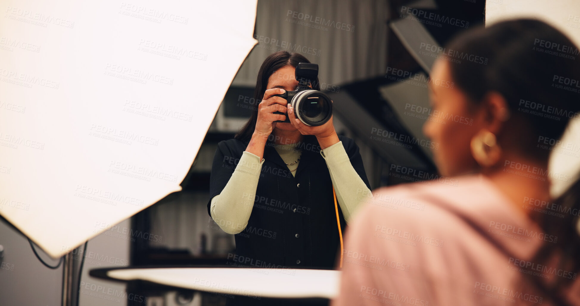 Buy stock photo Woman, photographer and camera on set for photoshoot, production and magazine casting. Female person, equipment and backstage with model for filming content, capture image and photography industry