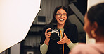 Woman, photographer and smile with camera on set for photoshoot, production and magazine casting. Female person, equipment and backstage with model for filming content, capture image and photography
